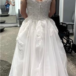 About a size 12 wedding dress worn once.